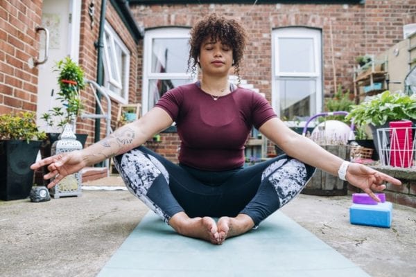 woman doing yoga outdoors