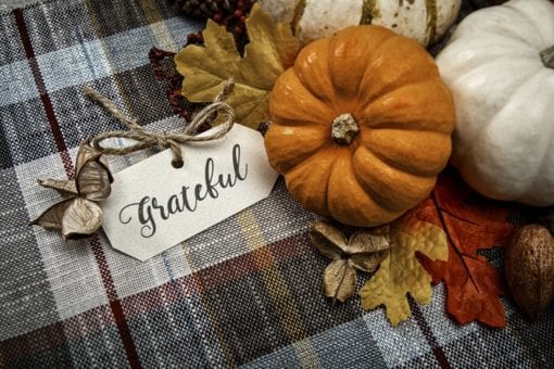 Grateful tag on table next to fall decorations.