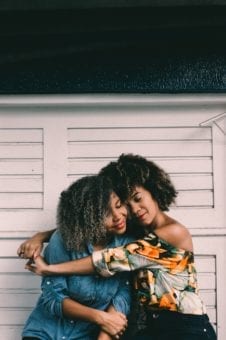 Two black women hugging