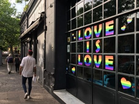 Love is love written on store window